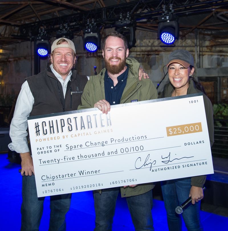 Josh with Chip and Joanna Gaines holding the $25,000 Chipstarter check